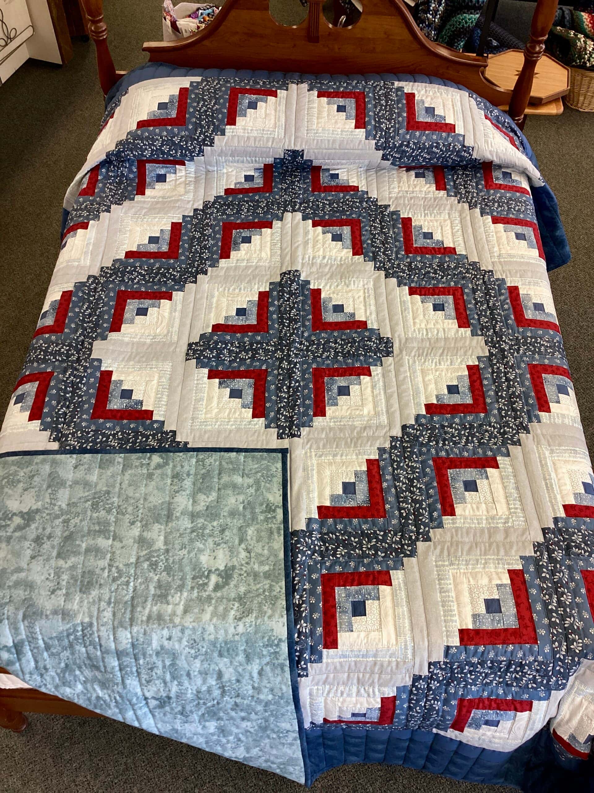 Blue and Red Log Cabin