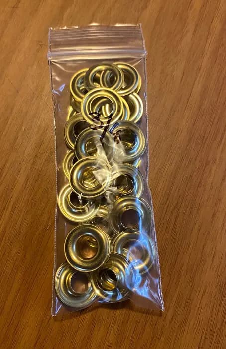 Grommets. Size 2″ 3/8 diameter holes. 25 sets per pack